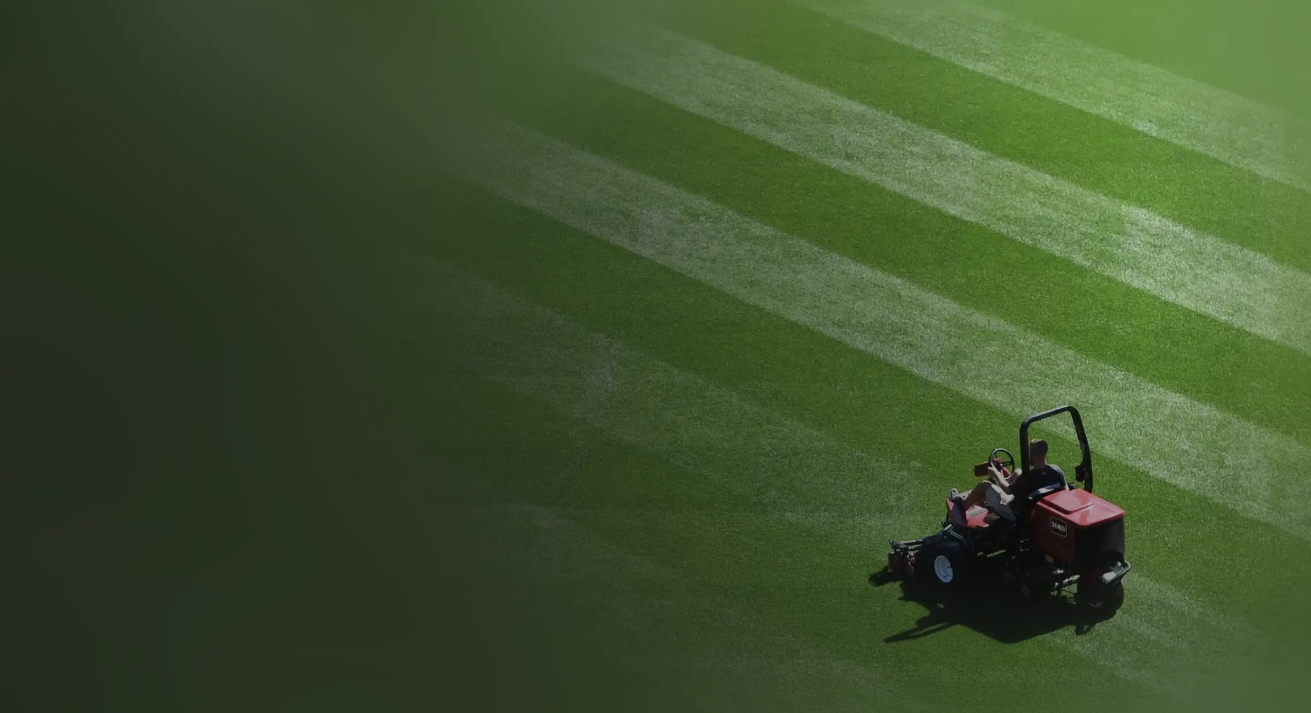 Landscaping Hero Image - Man working on a lawn